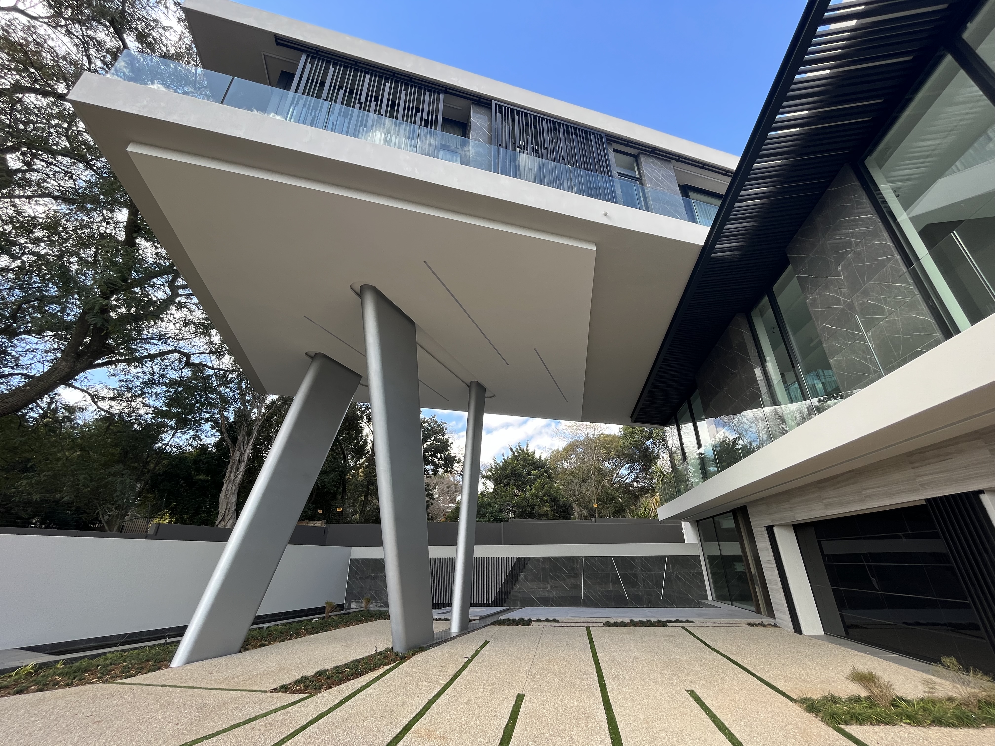View from below showing the angled structural column configuration