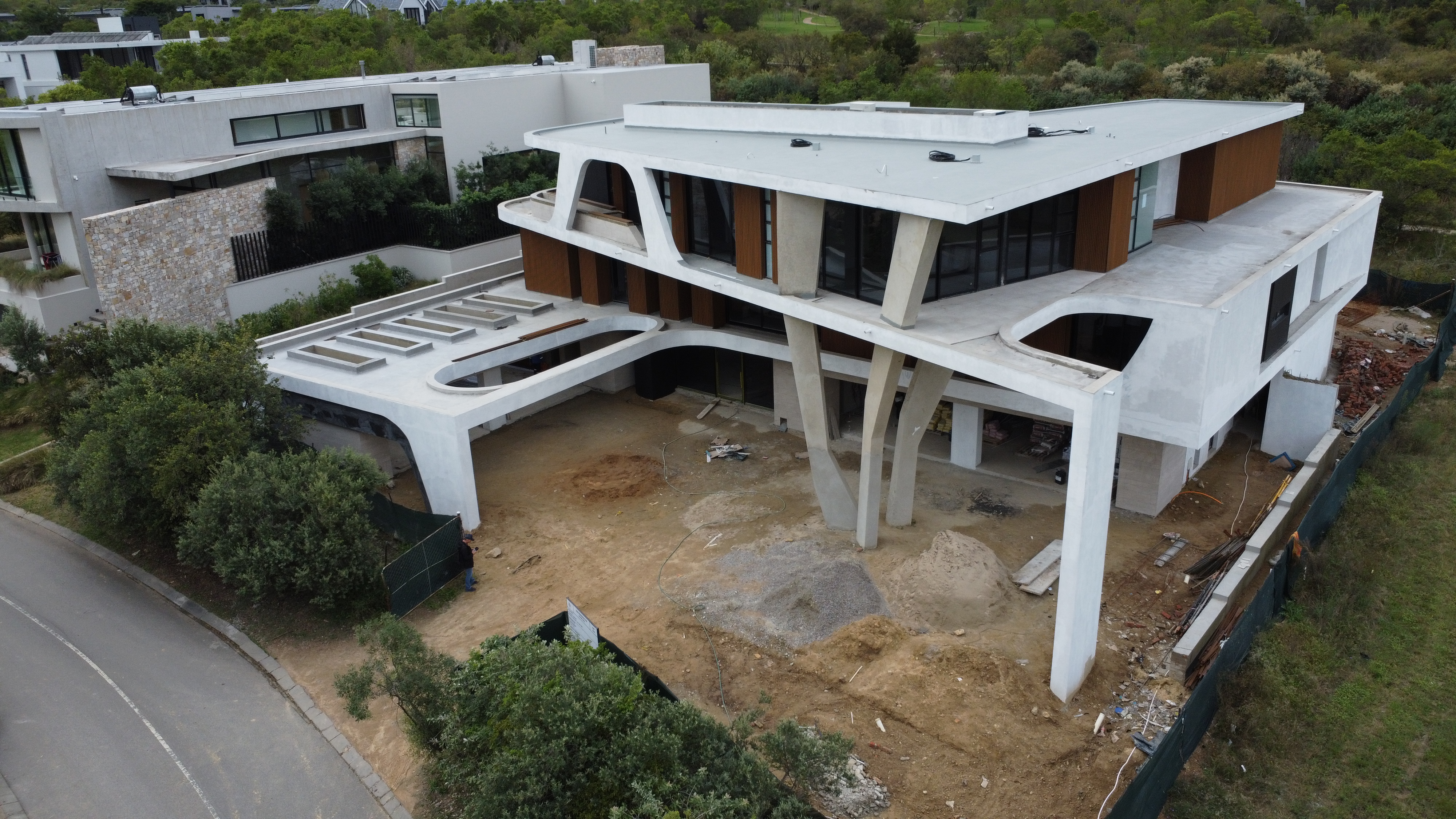 Curved-roof concrete home under construction